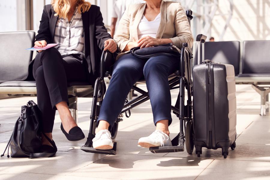 Two Woman Sitting At An Airport