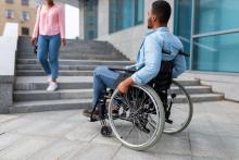 disabled man suffering from lack of wheelchair accessibility
