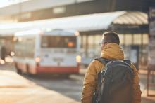 Passenger walking to bus stop