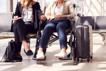 Two Woman Sitting At An Airport